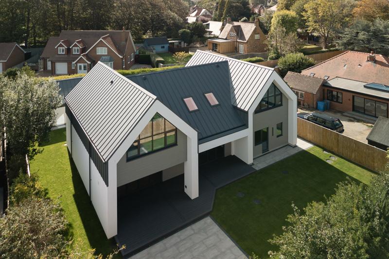 Aerial perspective of twin-gable PLX standing seam installation
